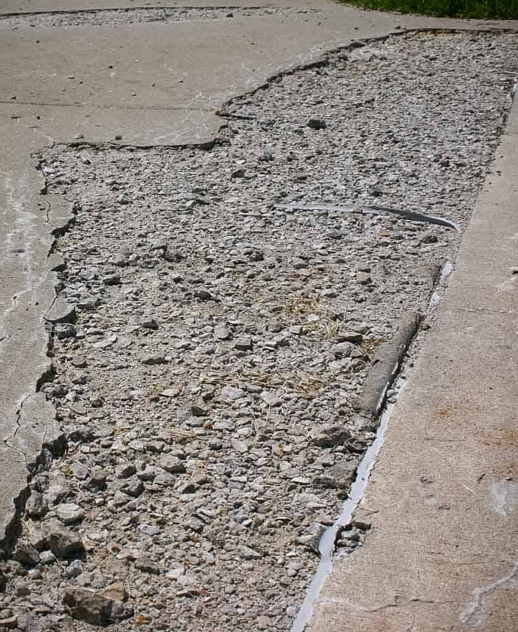 Salt damage to a concrete driveway.